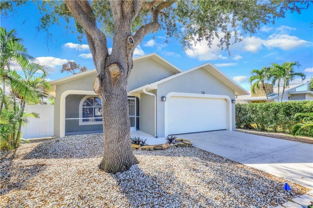 Photo of 718 95th AVE N, NAPLES, FL 34108 (MLS # 226015217)