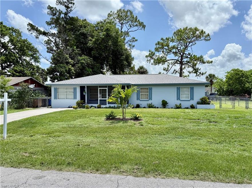 This beautifully maintained home offers over 1,700 square feet of living space and is packed with updates and bonuses inside and out. Enjoy peace of mind with a new roof (Nov 2022), along with fresh exterior and interior paint. The kitchen shines with refurbished counters and new stainless steel appliances (2023), while both bathrooms feature updated vanities. With dual A/C units, the home stays comfortable year-round without overworking the system. The versatile den with French doors could be the perfect home office or gaming room. One of the highlights is the oversized guest bedroom with private exterior access—ideal for a mother-in-law suite or added guest privacy. Step outside to a HUGE rear screened lanai, perfect for entertaining, overlooking a spacious fenced yard with fresh landscaping. There’s plenty of extra storage throughout the home, and you’ll love the convenience of central water and sewer—no water equipment to adjust. All of this is located in central Lehigh Acres, just minutes from schools, shopping, restaurants, and all the area’s main amenities. Don’t miss your chance to own this move-in ready gem at a great price!