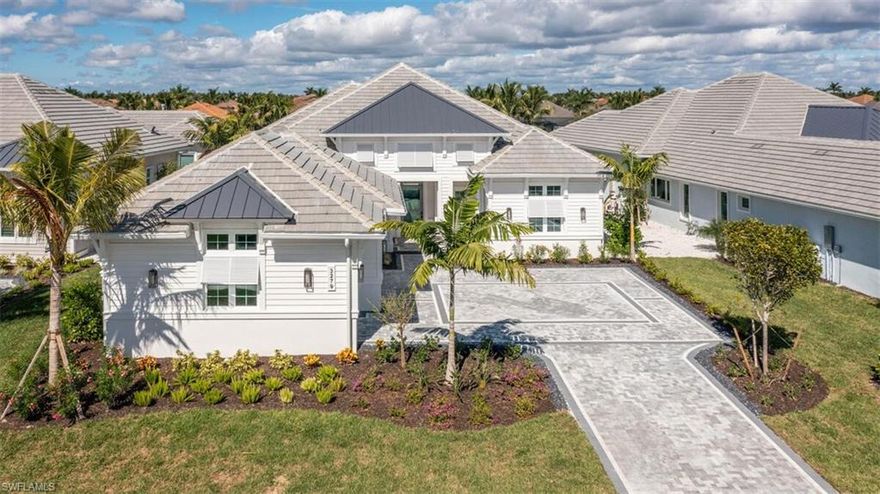 Why wait to build when you can enjoy the luxury of this recently finished, move-in ready & never-lived-in home right now for season! Don't miss out on this amazing opportunity! This home offers an array of incredible features and upgrades, too numerous to list them all. Some highlights include: Heated Salt Water Pool/Sunken Spa/Pool Fence. Towering Ceilings w/Shiplap, Beams, Coffered w/Crown Molding. Landscape Lighting Rear & Front. Wet bar w/Wine Cooler. Large Kitchen: Thermador Masterpiece Appliances, In wall Double Oven, Gas Cook top, Quartz Counter Tops. Walk-In Pantry:12 Solid Shelves, Base Cabinets, Quartz Counter Top, Outlets & Exhaust Fan. Grohe Faucets. Laundry Room: 42" Upper Cabinets, Lower Cabinets: Tilt-Out Cabinet w/Laundry Hamper, Pull Out Waste Bin. Undercabinet & Square Recessed Ceiling LED Lighting Throughout Home. Garage: Storage & Organization System, Electric Car Charger Outlet. 22KW Generac Generator.  Extended Covered Outdoor Living Space: Motorized Retractable Screens & Hurricane Shutters, Outdoor Kitchen. Many More Upgrades Too Many to List: Click Virtual Tour to Virtually Walk through this exquisite Home!