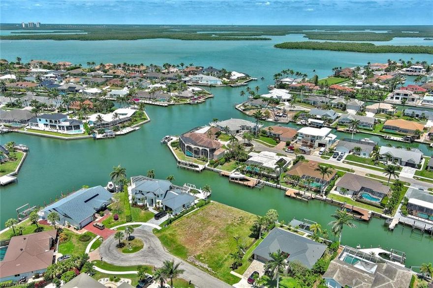 Exceptional Gulf-Access Lot on Marco Island – 100 Feet of Waterfront!

This top-tier, oversized lot offers a rare opportunity to build your dream waterfront estate on prestigious Marco Island. Boasting 100 feet of seawall and  Gulf access with  55ft bridge clearance on mean high water (MHW), this deep-water property is perfect for storing large vessels, yachts, and water toys of all kinds. With ample space for custom docks and boat lifts, this property is a boater’s paradise.

The land is cleared and build-ready, surrounded by upscale residences in one of Marco Island’s most desirable neighborhoods. Just a short walk to Publix, boutique shops, and local dining, and minutes from the famous Marco Island Beach, this location offers both tranquility and convenience.

Situated at the gateway to the 10,000 Islands, it’s ideal for avid anglers, boating enthusiasts, and families who crave adventure—or those looking to unwind in a laid-back coastal setting. A perfect investment for a luxury home, Airbnb, or high-end rental.

Build your vision in paradise—this one won’t last; if you’re looking for retirement, this is the dream!