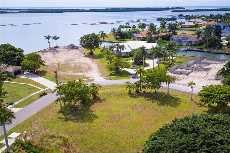 Enjoy a great value for this large, corner lot that is just over half an acre in the prestigious Estate section of Marco Island. Incredible opportunity to build a model home or your dream residence in a much sought-after neighborhood where properties across the street are over $3,000,000. Soil Test Done No Pilings Needed.
