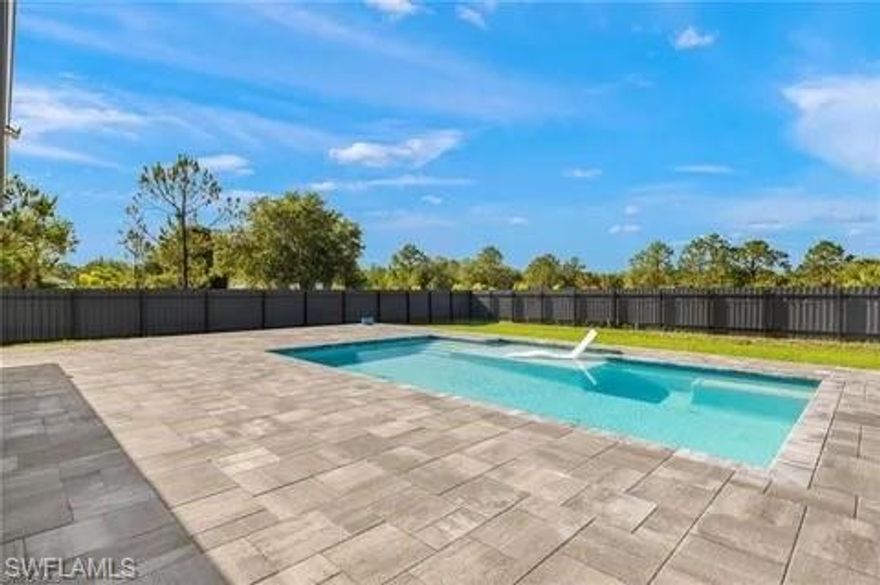 Built in 2022, this beautifully maintained 3-bedroom, 2-bath home is set on 1.14 acres of fully fenced land, offering a peaceful, rural lifestyle with plenty of space to breathe. Surrounded by larger parcels and open landscapes, this property provides the privacy and quiet that’s becoming increasingly hard to find—while still being within reach of everyday conveniences and areas experiencing continued growth and development.

The palm-lined, nicely landscaped front yard creates welcoming curb appeal. Inside, the home features a well-designed layout with a dedicated laundry room and utility tub, 2-car garage, and a whole-home reverse osmosis water system.

Step outside to your own private oasis—complete with a heated saltwater pool, expansive paver deck, and covered lanai—perfect for relaxing or entertaining in a serene, natural setting. The fully fenced acreage offers endless possibilities for outdoor living, recreation, or future enhancements.

A rare opportunity to enjoy newer construction, wide-open space, and the tranquility of rural living—while still benefiting from the momentum of nearby growth.