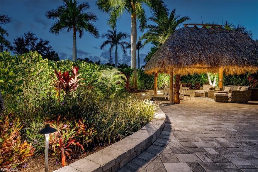 Lot 96 - Welcome to your own secluded paradise within the gates of the prestigious Naples Motorcoach Resort. Perfectly positioned on an oversized corner lot, this exceptional property offers abundant privacy, lush tropical landscaping, and an ideal location for enjoying all the resort’s premier amenities.

As you enter the resort, you are welcomed by stately fountains and manicured grounds before arriving at your property via a Royal Palm–lined boulevard. From the moment you pull in, the sense of tranquility is unmistakable. This beautifully designed lot is framed by four mature Royal Palms and surrounded by dense Calusa hedges, creating a serene, private retreat on all sides—including the front, where tropical greenery provides a peaceful view from your motorcoach.

The fully paved site has been thoughtfully laid out to accommodate your motorcoach with ample space for an oversized SUV and additional vehicle, a rare and valuable feature. Multiple seating and entertaining areas allow you to enjoy the outdoors throughout the day, whether relaxing quietly or hosting friends.

At the heart of the property is a new oversized tiki hut, offering an inviting space for entertaining, watching TV, or simply enjoying the sounds of nature in total comfort. In the evenings, gather around the fire table area and take in the ambiance created by custom landscape lighting that beautifully illuminates the tropical foliage.

Location is everything—and this lot delivers. You are just steps from one of the resort’s satellite pools and spa, complete with nearby bathhouse facilities, making relaxation effortless. A short stroll to the dog park ensures your four-legged companion enjoys the resort lifestyle as much as you do.

When not in residence, this property offers excellent income potential through the resort’s rental program, providing an opportunity for cash flow while sharing your oasis with others.

Naples Motorcoach Resort is a Class A–only, gated luxury resort featuring:

Resort-style infinity pool and hot spa

Fitness center and men’s & women’s saunas

Elegant clubhouse with owner-use kitchen and event space

Two satellite pools, each with hot spas, restrooms, and laundry facilities

Dedicated dog park

Whether you’re seeking a private winter retreat, an entertainer’s haven, or an income-producing investment, Lot 96 delivers an exceptional blend of privacy, location, and tropical elegance in one of Naples’ most sought-after motorcoach resorts