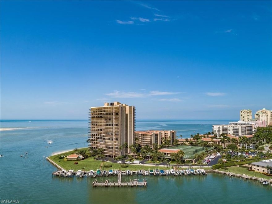 Marco Island Condo overlooking the Water!!  Private Balcony with Stunning Views of the Gulf Of Mexico will make this home sweet home.  The captivating 2 bedroom Condo is what you have been waiting for.  As you enter the front doors you will walk into the entertainer's kitchen with an extra-long island that provides plenty of space for gathering, entertaining, and dining.  The kitchen also has a dining/living room open floor plan. The split bedrooms are ideal for guests that have their own privacy and spectacular view that they will enjoy every time they walk into the room.  The Condo includes an inside Washer and Dryer. The views not only overlook the sparkling water, but it also has a view of the community pool.  Have a cup of coffee, tea, mimosa, or a drink of your choice as you take in the beauty of the gorgeous sunsets.  Walking distance to the beach, shops, restaurants, and more.  This is Island Living at its best in Paradise.