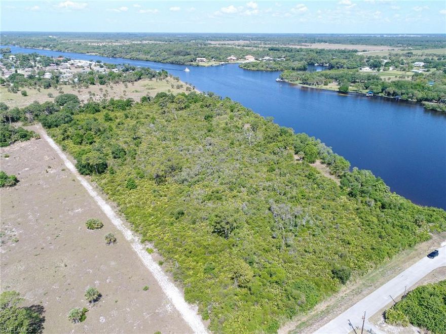 Rare opportunity to purchase approximately 14 river front acres in the Olga neighborhood, only a short drive to I-75 and downtown. This property is zoned vacant residential. Another rare feature is this property owns the adjoining river beach parcel into the water which will be a positive for boat dock and home building. There is approximately 1,000 feet of river frontage.  Includes PID 22-43-26-00-00004.0010, (1480 Linwood:  PARL IN NW 1/4 OR 2125 PG 2297).