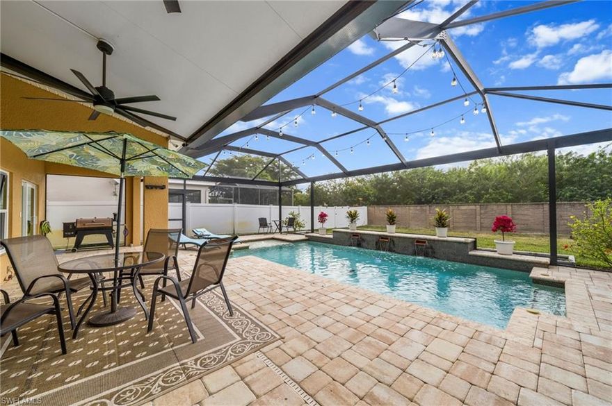 Beautifully upgraded 4-bedroom pool home with a den/optional 5th bedroom, loft, and 2.5 bathrooms, offering over 2,600 square feet of living space in the highly desirable Promenade West at The Forum in Fort Myers.

Enjoy Florida outdoor living in your private, fenced backyard featuring a custom saltwater pool with sun shelf and waterfall features. The covered lanai and heavy-duty screened enclosure with picture window provide the perfect space for entertaining or relaxing.

Inside, the open-concept kitchen is ideal for today’s lifestyle, featuring granite countertops, modern appliances, and seamless flow into the main living area with pool views. This layout is perfect for big families.

The primary suite offers a private retreat with crown molding, a custom walk-in closet, and a fully remodeled en-suite bathroom featuring a walk-in shower with rainfall showerhead.

Additional upgrades include:
• Impact windows throughout
• Epoxy-coated garage flooring with custom cabinetry
• Pre-wired generator hookup
• Culligan whole-house water filtration system

Located minutes from shopping, dining, I-75, RSW Airport, and downtown Fort Myers, this home delivers comfort, convenience, and long-term value in one of Fort Myers’ most sought-after communities.