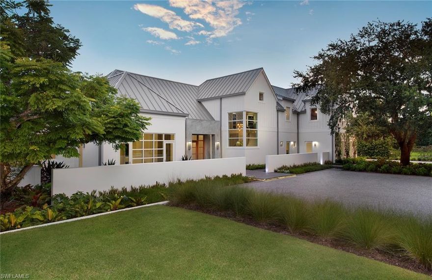 One-of-a-kind new construction in the heart of Pine Ridge, this “Farmhouse Chic” estate home features oversized windows and pocket sliding doors that diminish the boundaries between outside and in. The interior design compliments the inspired architecture with expansive rooms, soaring ceilings, and masterfully crafted details such as European white oak herringbone floors, Spanish limestone stair treads, and a hand-forged iron railing. Every inch of this stunning home is built with meticulous attention to detail and a rare design aesthetic. A 28’ tall great room wall is wrapped with antique hemlock barn siding which was milled and hand-finished on site. Six Ipe decks grace the perimeter and the private, fully landscaped grounds, and an 18' x 40’ pool and spa compliment the outdoor kitchen and living areas. Architectural plans are ready for a guest house design to compliment the main house. The guest house can go on the north west corner of the property. Thoughtfully designed by Herscoe Hajjar Architects, the concept and development are by Richard Donnelly, ROI Naples.
