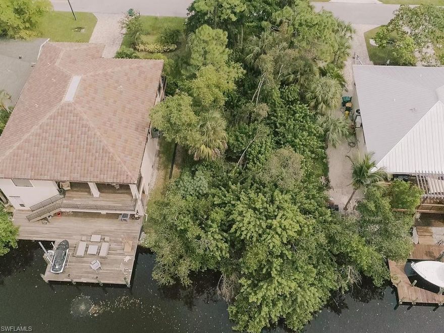 Rare find, canal lot with gulf access via Wiggins Pass, 12 min boat ride Gulf of Mexico in a quiet private community that has homes now valued over $1 million. HIGH & DRY!  Click on the virtual tour and get a bird's eye of this property!