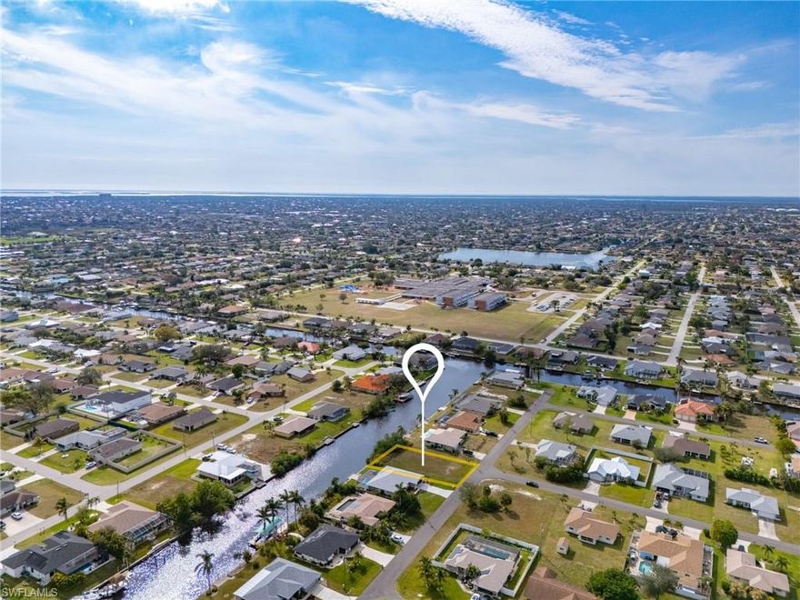 Are you looking for the perfect property to build your dream home on? Look no further! This GULF ACCESS lot is located in a desirable neighborhood in SW Cape Coral! Perfect to build your dream home or vacation home.  Centrally located near Publix, Target, multiple restaurants, less than 10 minutes to downtown Cape Coral, right next to Pelican Elementary, Challenger middle school, Cape High School, etc!  The property is right next to Pelican Blvd which is known for going all out on Halloween!  City water and sewer assessments are PAID OFF!! The vacant lot is 10,001 sqft.  The opportunities are endless.
WATCH THE VIRTUAL TOUR!!!
