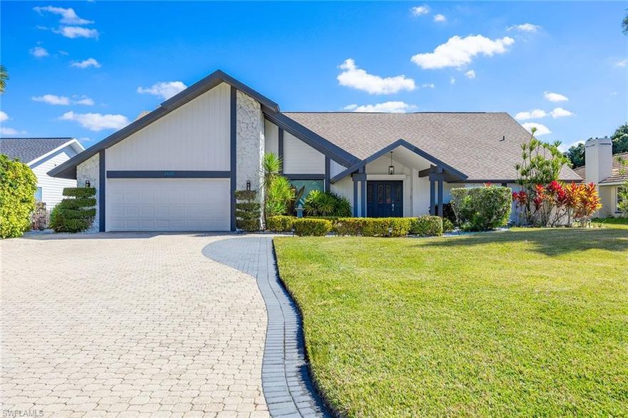 Welcome to this exceptional three-bedroom, two-and-a-half-bath residence nestled within the highly sought-after community of Kings Lake. From the moment you step inside, you're welcomed by pristine 18-inch diagonal tile flowing gracefully throughout the main living areas, complemented by soaring volume ceilings and an abundance of natural light that fills the home with warmth and elegance. Thoughtfully designed with a split floor plan, this residence offers both privacy and generous living space—ideal for families of any size or for hosting guests in comfort and style. A spacious formal dining room sets the stage for memorable gatherings, while the inviting living room features pocketing sliders that seamlessly open to an oversized covered lanai and sparkling pool, creating the perfect blend of indoor and outdoor living. A separate family room provides an intimate retreat, complete with a fireplace, custom built-in glass cabinetry, and a beautifully appointed, illuminated wet bar—perfect for entertaining. At the heart of the home lies a gourmet kitchen designed to impress, showcasing quartz countertops with an expanded backsplash, top-tier stainless steel appliances including a Frigidaire Gallery convection stove, custom cabinetry with crown molding, a built-in wine refrigerator, and a generous oversized island ideal for casual dining and conversation. The two guest bedrooms are well-proportioned, each offering large walk-in closets. One features sliding glass doors that open directly to the pool area. They share a beautifully appointed pool bath with granite countertops and a walk-in shower. The private primary suite is a serene sanctuary, highlighted by upgraded carpeting, pocketing sliders to the patio and pool, and a spacious walk-in closet complete with a custom organization system. The en-suite bath offers dual vanities, a separate soaking tub, and a distinctive walk-in shower featuring natural rock-inspired flooring for a spa-like experience. Step outside to your tranquil oasis—an expansive covered lanai overlooking a stunning pool with a cascading waterfall feature, providing the perfect setting for relaxation or entertaining under the Florida sun. Ideally located just minutes from premier shopping, golf courses, and the vibrant dining and cultural scene of Naples' renowned 5th Avenue, this remarkable home represents one of the finest values in Kings Lake.