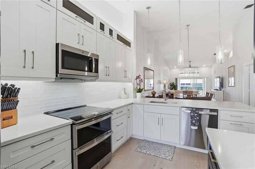 Modern Coastal End Unit Near Downtown Naples
Turn-key designer living with every detail already beautifully done.

For the buyer with a discerning eye and a love for polished, effortless living, this reimagined 3-bedroom, 2-bath end-unit residence in Falling Waters delivers a rare blend of style, substance, and ease. Every inch of the décor has been thoughtfully updated, with over $150,000 in improvements creating a home that feels current, curated, and completely move-in ready. There is no heavy lifting here, only the pleasure of arriving and enjoying.

Bathed in natural light from its desirable western exposure, the interiors feel bright, expansive, and inviting throughout the day, with a warm glow that lingers beautifully into the evening. Rich engineered wood flooring, crisp new baseboards, detailed casement moldings, fresh interior paint, recessed lighting, and direct-drive ceiling fans with integrated lights establish a clean architectural backdrop with a quietly sophisticated edge.

At the heart of the home, the kitchen has been fully transformed into a true design statement. Expanded custom cabinetry, a dramatic quartz waterfall-edge island, hidden outlets, pendant lighting, statement chandeliers, and GE Profile appliances come together in a space that is as functional as it is striking. It is tailored, elegant, and made for both everyday living and stylish entertaining.

Both bathrooms have been completely redesigned with a layered mix of texture and tone, featuring designer tile work, quartz vanities, LED mirrors, new toilets, and seamless glass shower doors. The primary suite offers a serene retreat with ocean-inspired tile, a double-sink quartz vanity, new pocket doors, cedar closet shelving, and brushed gold finishes that add warmth and understated glamour.

The lanai extends the living experience with upgraded lighting, an under-counter GE refrigerator, and a built-in BBQ, creating a seamless indoor-outdoor setting that feels distinctly Naples. It is the kind of space that invites slow mornings, sunset cocktails, and easy entertaining.

Beyond the residence, Falling Waters is known for its lush tropical setting and resort-style atmosphere, centered around one of the largest lagoon-style saltwater pools in Naples, complete with waterfalls and beautifully landscaped grounds. Residents also enjoy an updated clubhouse, tennis and bocce courts, a putting green, and a vibrant social scene.

Just minutes from Downtown Naples, Tin City, and 5th Avenue South, this is a rare opportunity to own a spacious, design-forward home that lives with the ease of a luxury retreat.

Sophisticated, sunlit, and completely turn-key, this is for the buyer who wants designer style without the renovation, the waiting, or the compromise.