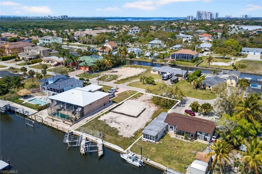 Discover an exceptional opportunity to build your dream home in the highly desirable Imperial Shores community, located West of US-41 and nestled along a serene canal. This prime location is only about a mile from the pristine sands of Barefoot Beach and Bonita Beach, offering easy access to some of Southwest Florida’s finest beaches. This spectacular Gulf-access lot boasts coveted Southern exposure for breathtaking sunsets and prime sun over your future pool. With just a short boat ride to the Gulf of Mexico, it’s the perfect spot for boating enthusiasts and beach lovers alike. This homesite includes a FABULOUS boat set up with 2 boat slips/docks, providing seamless access to the Gulf. Additionally, there are two separate routes to the Gulf—one with a bridge and one without—ideal for sailboats and larger vessels. The deep canals provide consistent Gulf access, even at low tide, making this property an ideal choice for year-round boating. This rare gem offers the ideal canvas to build your custom residence, designed to your exact specifications and incorporating the latest building codes. With no HOA fees and zoning that permits both single-family or multi-unit development, it also presents an exceptional opportunity for rental income or investment. Fantastic location near many top-rated local restaurants, close to the Promenade, Coconut Point Mall & Mercato, with easy access to RSW International Airport.