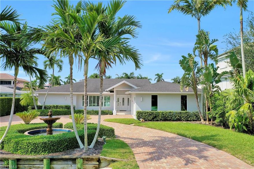 Spectacular and move-in ready, this three bedroom and two full bathroom, waterfront home offers the best of both worlds in Florida living! Enjoy boating right outside your door and private beach access to miles of soft white-sand and sparkling emerald waters just footsteps away. An expansive and bright, great room floor plan is the highlight of this completely updated home. Countless additional improvements include; marble and ceramic tile flooring, kitchen center island, granite counters, impact windows, and plantation shutters throughout. The split bedroom floor plan mirrors a contemporary design, with ample room for the master suite offering his/her closets, water closet, separate French soaking tub and shower. The guest wing is conveniently located on the opposite side of the home. A set of newly installed, glass pocket sliding doors open the main living area up to the outdoor living space, creating the ultimate in entertaining for you and your guests! Owners will appreciate the prime location, within walking distance to LaPlaya Beach & Golf Resort and a short drive to the Ritz-Carlton Naples, Mercato and Waterside Shops.