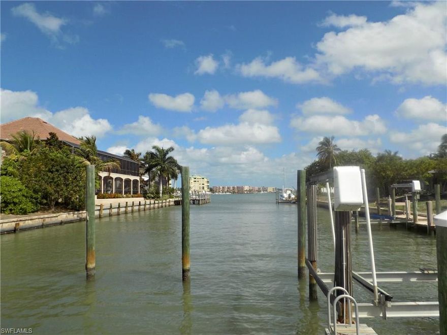 Rent it, live in it or tear it down and build new with quick out to Marco Bay and views of the river. 3 bedrooms 2 baths with cathedral ceiling in living room. Dining room adjacent to kitchen U shaped Deltona Home.