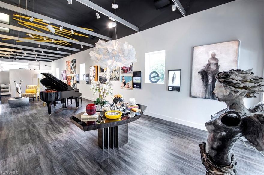 Exquisitely designed and executed industrial condominium in the Naples Art District. Spearheaded by local artist Jan Edwards and designed by renowned designer Judith Liegeois, this unit has been transformed into a masterpiece. Unit 208 is positioned at the rear of the building (east side), with no unit directly to the east. Ample lighting abounds with windows and skylights. This unit underwent a top to bottom design/renovation. New flooring, lighting, AV system, kitchen, laundry, full bathroom, custom cabinetry, Jakob Schlepper wallpaper and an abundance of hues, patterns and textures create a creative and inviting space. Perfect for an artists studio, showroom, man cave or she shed, the possibilities for this property are endless. Featured in Gulfshore Life: Article: Local Color. Adjacent unit (207) is also available for purchase.