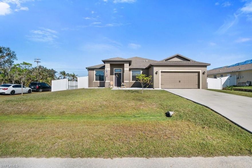 This warm loving home for sale is a stunning 5 bedroom, 3 full bath, 2 car garage property situated on a corner lot in the prime location area of SW Cape Coral built in 2015. It features a screened-in saltwater pool heated by solar panels surrounded by pavers. Well-kept landscape including banana & mango tropical trees.  Enjoy all the amenities this beautiful home has to offer including an open concept floor plan, ceiling fans, tile & carpeted floors throughout, a chef's kitchen with dual sink, granite countertops, stainless steel appliances, and abundance of cabinetry, laundry room w/ washer/dryer. Master bedroom w/ensuite including his/her vanity, walk-in shower, tub,  spacious walk-in closet and thermostat. Guest rooms boast Jack n Jill bathroom w/handicap accessibility.  Screened in Lanai w/vinyl fence surrounding property for your private gatherings with friends/family. HVAC is NEW. Close to shopping centers, restaurants, parks, medical facilities and churches.  Don't miss out on your chance to own this amazingly lovely home for you and your family to create and share new memories.