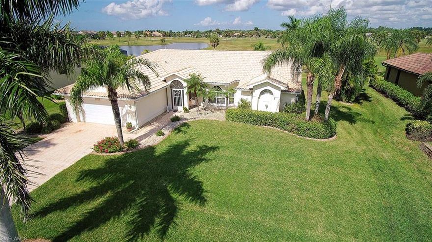 Fabulous Paul home in Cape Royal. Lushly landscaped with a  sparkling heated pool  and spa with pavers on the large lanai  for entertaining.  This home is  very well maintained and has a great layout with a large great room with  cathedral ceilings. Nice sized guest bedrooms and plenty of storage. Eight foot sliders in great room and master bedroom afford a beautiful view of the golf course  and lake. Tile roof, stamped concrete driveway and hurricane shutters on the home. Granite countertops in the kitchen and both bathrooms in  this  gorgeous home on one of the most sought after streets in Cape Royal. Cape Royal is a Premier Country Club and Golfing community with super low HOA dues and in unincorporated Lee county which equals lower taxes. Bring your best buyers because this home will not last!!! This is the best priced home in the entire community and it is very clean and shows great!  Check out the virtual tour!