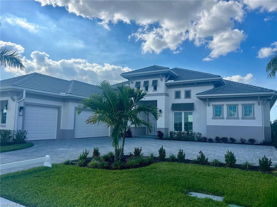 YOUR PICKLE BALL FRIENDS ARE HERE! NEW CONSTRUCTION in CAYMAS! This new community by STOCK Development is a must see! This is your opportunity to live in the Gardenia floor plan in 2026. The Gardenia will offer a gas kitchen cooktop and outdoor kitchen in nearly 1000 square feet of covered lanai living space and a beautiful custom pool and spa package with a gorgeous view. Many options and upgrades. Caymas is set on 780 magnificent acres in a prime Naples location, offering an incomparable waterfront lifestyle in an unmatched setting enriched by exclusive amenities offering a kayak launch, golf simulator, private theater, billiards and indoor and outdoor dining, bocce, dog park and much more. The stunning 25,000 square foot clubhouse offers a variety of ways to connect with friends and neighbors.
(Exterior photo is a rendering of the Gardenia Floor Plan Elevation.)