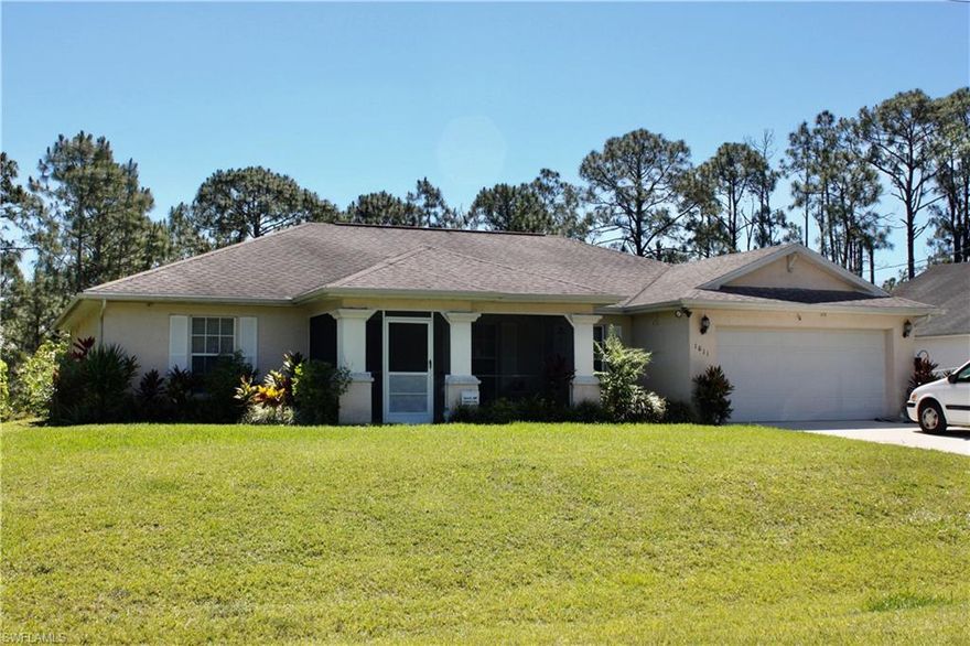 Take a look at this popular floor plan with open great room and large kitchen! Oh you will love the southern exposure. Enter through the screened porch. Great for having coffee in the morning. The open feel of the home is perfect for entertaining. Gorgeous laminate flooring is new. Kitchen features all appliances, breakfast bar, pantry, eating area and plenty of cabinets. Master has a large walk in closet, bath has dual sinks, tub, shower and linen closet. Guest quarters have a jack and jill bath, opening to the den and both bedrooms. Den has french door that has endless possibilities for usage. Inside laundry has washer and dryer with shelving that leads to the 2 car garage and has a tankless water heater! The exterior will wow you!! Especially the southern exposure backyard oasis! Many different, too many too count, fruit trees! Yard is well manicured with lovely plants and flowers of all kinds. Enjoy dinners and cocktails on your private lanai watching the wildlife. Home has gutters all around and will not disappoint any buyer. See it today!