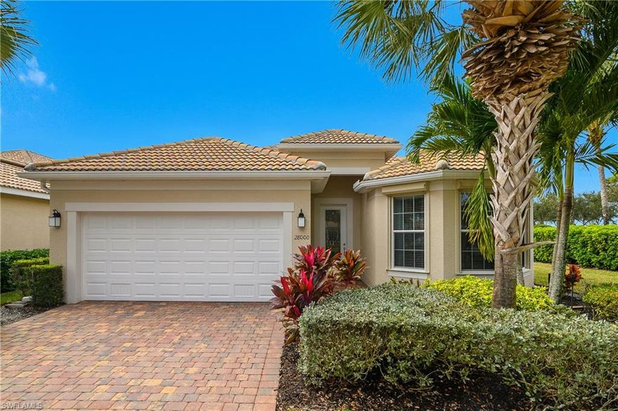 Welcome home to this beautifully upgraded Vernon Hill floor plan in the amenity rich community of Village Walk of Bonita Springs, perfectly positioned on a private corner west-facing lakefront lot where you can relax on your extended lanai and enjoy breathtaking sunset views. Thoughtful upgrades are found throughout, starting with the kitchen featuring granite countertops, tile backsplash, stone-accented bar, convenient pull out second pantry storage cabinet adjacent to the refrigerator, a plantation shutter in the eat in kitchen, and a built-in desk, making it as functional as it is inviting. This home offers a bright, open feel with crown molding in the main living areas, recessed lighting, a glass-insert front door. The light tile flooring throughout main living areas are complemented by luxury vinyl plank flooring in all bedrooms—no carpet.  Both the primary and guest baths feature custom tile and glass walk-in showers, while the primary suite includes a barn-door style entry to the bathroom and a spacious walk-in closet, offering exceptional storage and convenience.  Additional highlights include a fresh exterior paint (2024), an epoxy-coated garage floor, electric storm shutters on the lanai, and manual shutters for the remainder of the home.

Village Walk of Bonita Springs, a 24 hr guard-gated community, is a resort-style community known for its vibrant social scene and full-time lifestyle director. HOA fees include lawn care, irrigation, cable, and internet, allowing you to truly enjoy a maintenance-free lifestyle. The picturesque lakefront town center offers a restaurant with indoor and outdoor dining options,  resort-style pool and lap pool, state of the art fitness center, tennis, pickle ball, bocce, basketball, kid's playground, gas station, ice cream parlor, bagel shop, salon, and touch less car wash.

Village Walk was designed for connection and outdoor living, with miles of scenic walking paths, sparkling lakes, a unique butterfly park, and charming pedestrian bridges. Just across the street, Crew Flint Pen Strand Trails provide 1,500 acres of preserved nature with walking, biking, and equestrian trails. Ideally located only 4 miles to I-75, 20 minutes to RSW Airport, 25 minutes to Bonita Springs's beautiful beaches, and minutes from the upcoming Midtown Bonita shopping and dining destination.