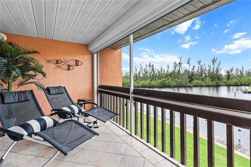 This waterfront 2 bedroom/2 bath condo with an association-owned (first come/first serve assigned) boat slip that gives you direct access to the Gulf of Mexico through Buckley's Pass to Charlotte Harbor. There are beautiful views & sunsets from all of the rooms across the back of the condo. Your screened-in lanai has plenty of room for outside entertaining. This light & bright, move-in-ready, end unit is very private & is being sold turnkey. The laundry room has a full-size washer & dryer plus lots of storage. It has electric roll-down hurricane screens on the balcony & impact glass windows. A new roof was put on in 2021 & there are no assessments. Owners are allowed 2 pets. Be out in your boat during the day, relax in the pool before dinner & enjoy the sunset from your balcony. The perfect place to live year-round or seasonally.