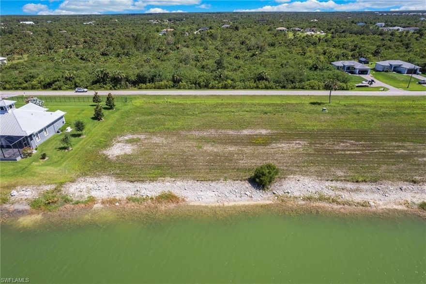 Build your dream home on a premium waterfront lot with a gorgeous long view down the middle of the lake! One hundred percent upland and ready to be built on, this 2.24-acre lot in the 20-home neighborhood of Saddlebrook Lakes is a hidden gem. Surrounded by preserves, the nature views are incredible. This 150-acre, fresh water, private lake has a resident trail for walking and jogging. Construct your own private boat dock in your backyard for fishing and sunset cruises. The community is near the Crew Bird Rookery and close to Publix and Interstate 75, and just 30 minutes to Southwest Florida International Airport.