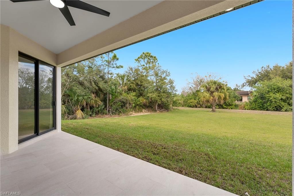 Photo of 715 Theodore Vail ST E, LEHIGH ACRES, FL 33974 (MLS # 226005491)