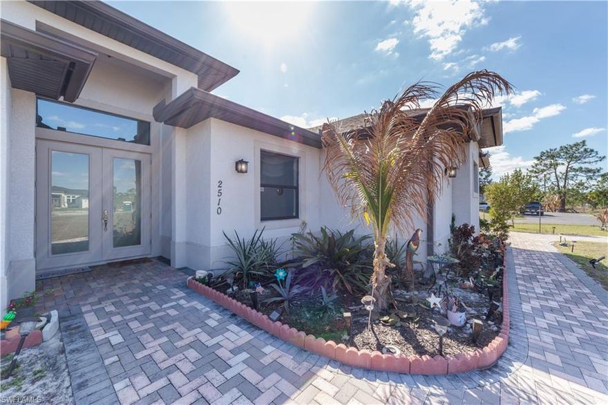Fantastic architectural elements and attention to detail on this ALMOST NEW 3 + Den / 2 Bath Home.  The home was built in 2018 and features a clear, dry lot and has a long pavered driveway leading up to your beautiful new home.  This spacious open floor plan has custom kitchen cabinets, high impact windows and doors, tile floors throughout the house, granite counter tops in kitchen and bathrooms, stainless steel kitchen appliances, the master features 2 walk-in closets, and a HUGE walk-in shower.  Top it off with a spacious screened-in tiled lanai with small summer kitchen and an attached 2 car garage.