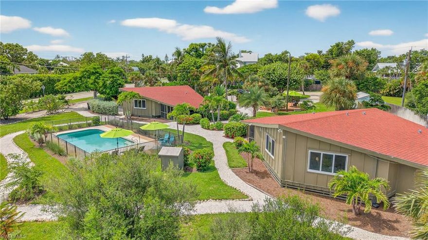 Tucked away on Sanibel’s serene East End, The Palms of Sanibel captures the very essence of island enchantment. Set on over an acre of lush, near-beach paradise, this boutique resort is a rare opportunity to own a piece of Sanibel’s storied charm—where palm fronds sway in the sea breeze, the scent of salt air lingers, and each sunset feels like a private celebration. Two picturesque coastal-style buildings house four beautifully appointed rental cottages, each offering the comforts of home with the allure of a tropical escape. Every residence features inviting living spaces, full kitchens, cozy bedrooms, and thoughtfully designed baths, creating an atmosphere that’s as effortless as it is elegant. Some cottages boast screened porches that open to the whisper of the island’s warm breezes, where laughter drifts through the palms and evenings are illuminated by golden twilight. Just a leisurely stroll away lie Sanibel’s world-renowned beaches, known for their endless shells and tranquil beauty. Guests can easily wander to Lighthouse Beach Park, explore the island’s boutique shops and local dining favorites, or simply unwind beneath a canopy of tropical foliage. At the heart of the property, a sparkling resort-style pool invites relaxation under the Florida sun, complete with ample lounge seating and an open-air pavilion perfect for gatherings, celebrations, or intimate island events. Additional amenities include on-site laundry facilities and a versatile outbuilding—ideal for storage, a workshop, or creative expansion. Whether envisioned as a thriving boutique investment, a private family compound, or an exclusive retreat for friends and guests, The Palms of Sanibel offers a world of possibilities wrapped in timeless island charm. Here, fun and finances intertwine effortlessly, and every day feels like a vacation—just moments from the turquoise waters and sugar-white sands that make Sanibel one of the most cherished destinations on Florida’s Gulf Coast. The Palms of Sanibel: where coastal serenity meets opportunity, and paradise pays dividends.