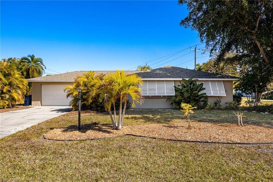 Remodeled after Hurricane Ian with fresh finishes and smart updates, this Fort Myers single-family home in Tahitian Shores delivers easy Florida living on a spacious corner lot—just minutes to the Caloosahatchee River, boating, fishing, and Gulf Coast fun. Inside, you’ll find new flooring, new baseboards, new interior doors, and double-pane windows (non-impact) for added comfort and efficiency. The layout is simple, functional, and flexible: 2 bedrooms + 2 full baths plus a large bonus/flex room that can easily serve as a third bedroom, home office, gym, or recreation room. Enjoy meals in the dedicated dining area or the eat-in kitchen, which looks out to the fully screened lanai—perfect for morning coffee and breezy evenings. Step outside to a private backyard oasis with mature, shade-giving trees and tropical charm, featuring macadamia, camphor, and garambola (star fruit) trees. The oversized property leaves plenty of room to add a pool and spa, expand the home, or create the outdoor entertaining space you’ve been dreaming of. No HOA restrictions means more freedom for boats, hobbies, and your lifestyle. Convenient to Sanibel Island, Fort Myers Beach, Margaritaville Beach Resort, plus dining, shopping, and entertainment—while still tucked into a quieter neighborhood setting.
