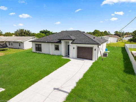 Photo of 2814 12th ST SW, LEHIGH ACRES, FL 33976 (MLS # 226027289)