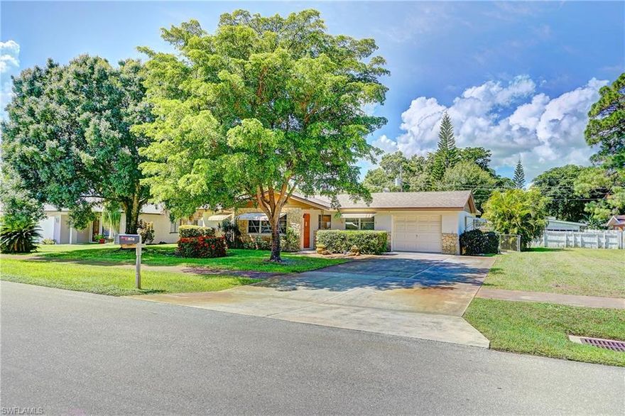 Looking for a well-kept family home in a quiet neighborhood right in the heart of Fort Myers?  Look no further than this charmer in Palmlee Park that is convenient to shopping, hospital and just blocks from the Fort Myers Country Club.  This 3 bedroom 2 bath home with 1.5 car garage offers a huge workshop for the woodworker or other hobbyist to enjoy their craft.  Featuring an updated kitchen with Corian countertops and loads of storage as well as a pass-through  to a bright and cheery family room with built in bookshelves.  The Family room overlooks a fully fenced, beautifully manicured backyard with patio and screened lanai.  Your family will love the ambience of the electric fireplace in the living room in addition to the whole-house attic fan to keeps things comfortable. Come take a look today!