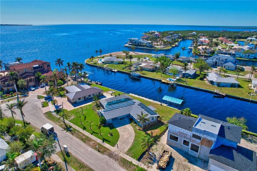 JUST REDUCED! AMAZING vIew in a Great Location! Direct Gulf Access | Resort-Style Pool | Solar-Powered Paradise!!!
Welcome to your waterfront dream home—where luxury meets laid-back coastal living and every sunset feels like a celebration. Located just minutes from Charlotte Harbor, this tropical oasis offers 110 feet of seawall, a covered boat lift, and world-class boating right from your backyard. Dolphins, manatees, and endless adventure await. Features That Inspire:
Updated Gourmet Kitchen with granite counters & stainless-steel appliances,
NEW 80 Solar Panels for energy efficiency and peace of mind,
Oversized Heated Pool with new cage, pump, and panoramic water views,
Whirlpool Tub in guest bath for spa-like relaxation,
New AC, Roof, Window Screens—move-in ready and worry-free,
Tile Throughout for cool, coastal comfort,
Lush Landscaping with fruit-bearing trees: grapefruit, orange, kumquat, lemon, tangerine & banana!
Bonus Florida Room with mini-split AC—perfect for entertaining, lounging, or working with a view. Prime Location: Close to Sunseeker Resort, Fishermen’s Village, beaches, parks, airports, schools, and vibrant waterfront dining. Whether you're boating, fishing, shopping, or simply soaking in the sunshine—this home puts you at the heart of it all.
Picture yourself poolside with a cocktail in hand, watching the sky turn gold over the water. This isn’t just a home—it’s a lifestyle.
Fall in love. Make the move. Welcome to paradise. Call today for your private showing!
