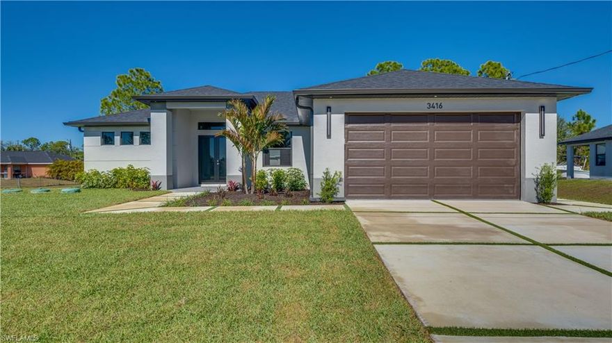 It has never been easier to own a home. Seller offering buyer incentives to improve affordability, including interest rate buy-down, mortgage payment assistance, or contribution toward buyer’s closing costs. Buyer may choose one incentive. Subject to qualification and lender approval. Experience modern luxury in this nearly 1,900 sq ft custom-built home, crafted with high-end finishes and exceptional attention to detail. An open floor plan with sleek tile flooring, 9' ceilings, 10' tray accents, and 8' doors creates a bright, elevated living space. The split-bedroom layout includes 3 bedrooms, a large den with pocket sliders, and 3 full bathrooms featuring custom vanities, backlit mirrors, and unique tiled showers. Every closet is fully outfitted with custom built-ins. The primary suite offers a spa-like retreat with an oversized walk-in closet, dual vanities, and a spacious walk-in shower. A private cabana-style bedroom serves as a second ensuite—ideal for guests or future pool access. The chef’s kitchen showcases modern European-style cabinetry with under-cabinet lighting, quartz countertops, a waterfall island, a large pantry, and brand-new Samsung stainless steel appliances. The dining area and great room open through 8' sliders to an expansive lanai with matching tile and full outdoor kitchen hookups. Additional features include a well-appointed laundry room with a utility sink and Samsung washer/dryer, an epoxy-finished garage, impact windows and doors, and a striking grass-interlaced driveway. The backyard has plenty of room for a pool. No flood insurance required. This home delivers thoughtful design, premium finishes, and standout quality rarely found at this price point. Come experience it for yourself!