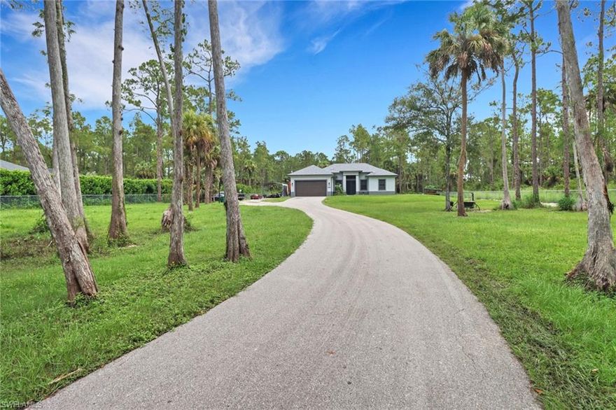 Escape to your own private paradise with this exceptional 2.5-acre property, meticulously built for peace and security. Located behind an electric gate and surrounded by a perimeter fence, privacy and tranquility await you at every turn. The entire home is equipped with impact doors and windows, ensuring peace of mind and energy efficiency. Enjoy pure, clean water throughout the house with a whole-house reverse osmosis water system, providing unparalleled water quality and taste. The home features top-of-the-line appliances, custom cabinetry, and granite countertops. The spacious living areas are perfect for entertaining. As you retreat to the primary suite, a sanctuary with a spa-like ensuite bathroom, complete with a soaking tub and walk-in shower. Each additional bedroom offers comfort and privacy, ideal for family or guests. The carport in the yard provides a convenient covered area for vehicles, boat, RV, and other toys! There is plenty of room for future guest house, pool, workshop or any additional structures. This property offers the perfect blend of seclusion and convenience, with easy access to shopping, dining, and schools. Don't miss out on the opportunity to own a home that combines luxury, security, and serenity. Schedule your private tour today!