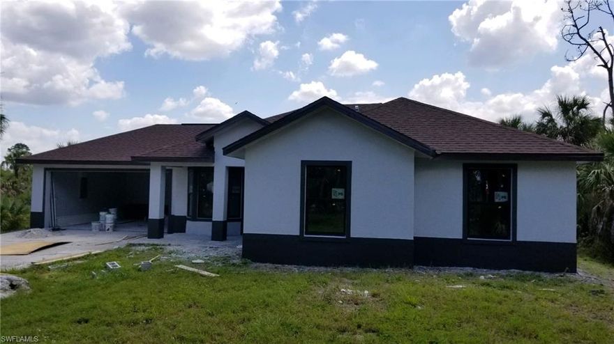 Beautiful home completely remodeled including frame, roof, insulation, electrical, AC, plumbing, tiled in the main area and laminated floors in the bedrooms, drywall, all interior trim, windows, freshly painted, new solid wood kitchen with quartz counter tops, new stainless steel appliances, new bathrooms.  So in essence it's like a new construction.  The only thing original is the septic, well, foundation and the shell!!!  Home sits on 1.14 acres.  Don't miss this opportunity to get this home at this incredible price!