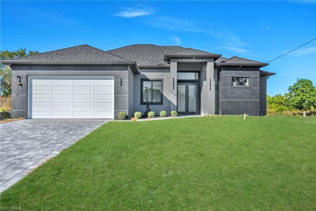 Photo of 3110 23rd ST SW, LEHIGH ACRES, FL 33976 (MLS # 226005646)