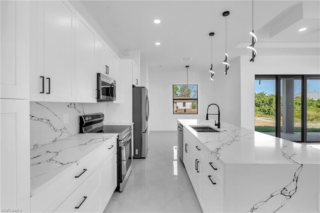 Photo of 3110 23rd ST SW, LEHIGH ACRES, FL 33976 (MLS # 226005646)