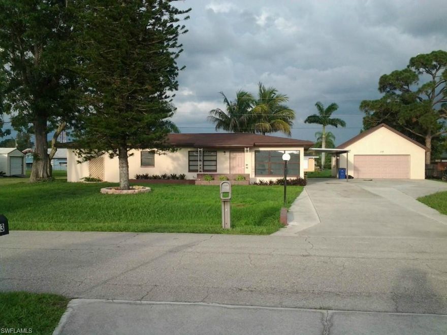 This wonderful home is located in central Lehigh Acres, Florida. It is in a well- established neighborhood on a sprawling 1/3 acre home site, with no homeowner’s association fees or deed restriction. Come see this 1800 sq. foot home which offers 3 bedrooms, 2 bathroom, a large Florida room, plus a bonus room so your family has room to grow. It also features an immense open patio, a 1 car carport, and a huge detached garage, offering 576 sq. feet. This beautiful home has been completely redone inside, including a newly remodeled kitchen in 2014, which features solid oak cabinets and a ceramic tile backsplash. Both bathrooms have been completely remodeled, one features a shower/tub combo, and the other a walk in 4’x 5’ shower. The air conditioning system was replaced in 2012. It also has a new roof that was installed in 2012. All this for only $53 dollars per sq. foot. You won’t find a better deal, within a short distance of many shops and grocery stores. This is a must see!!!