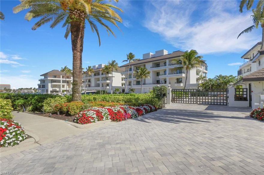 Along Gulf Shore Blvd sits this coveted 2nd floor residence at Ardissone presenting a delightful opportunity for refined waterfront living with your personal boat dock just outside your door. Framed by vast Venetian Bay views and lush landscaping, the home offers a front-row seat to dolphins at play and the gentle rhythm of passing boats.
Beyond the gated entrance and a few steps from your two parking spaces, a private elevator brings you directly to your spacious foyer. Thoughtfully re-designed and extensively renovated with continued enhancements in recent years, the residence features 2BR, a Den, and a nearly 300 sq ft Family Room (not included in the interior sq ft), created from an enclosed balcony with impact sliding windows and seamlessly blending indoor comfort with the beauty of the waterfront.
The primary suite is a true sanctuary with a luxurious sitting area and a serene atmosphere designed for ultimate rest and retreat. Throughout the home you’ll find exquisite Diana Royal marble floors, custom doors and detailed baseboards reflecting a commitment to quality craftsmanship and understated elegance. The chef’s kitchen is complimented by new appliances added in 2022, a large pantry, natural stone counters, and abundant natural light. 
Ardissone has recently completed a comprehensive transformation, including a new roof (2023), freshly painted exteriors, garages and railings, new gutters and drainage systems, a beautifully reimagined pool and spa with new gunite interior and tile, and elegant new pavers throughout the development. Residents also enjoy a deeded walkway providing direct access to the pristine beach and the Gulf—an exceptional amenity that completes this intimate coastal lifestyle in Naples.