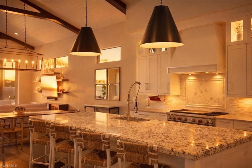 Located in the Watercourse section of Talis Park, this furnished residence offers approximately 3,638 square feet of living space. The home includes three bedrooms, a den/office, four full bathrooms, and a 2.5-car garage with additional space suitable for a golf cart.

Interior features include hardwood flooring throughout the main living areas and a chefs kitchen with upgraded cabinetry, a large center island, natural gas cooking, a Wolf double oven range, Fisher & Paykel dishwasher, and Gaggenau refrigerator.

Outdoor living includes a covered lanai with a summer kitchen and an infinity-edge salt water pool and spa overlooking a lake. The second level features two ensuite bedrooms with walk-in closets and a loft area. The main level primary suite includes a spacious bathroom with a walk-in shower, dual water closets, and a large walk-in closet.

Additional features include a whole-house Generac generator, tankless water heater, and built-in Sonos sound system.

Talis Park amenities include a golf course designed by Greg Norman and Pete Dye, dining venues, fitness facilities, tennis, pickleball, bocce courts, dog parks, and walking and biking paths. The community is located in North Naples with access to shopping, dining, beaches, and regional airport service.