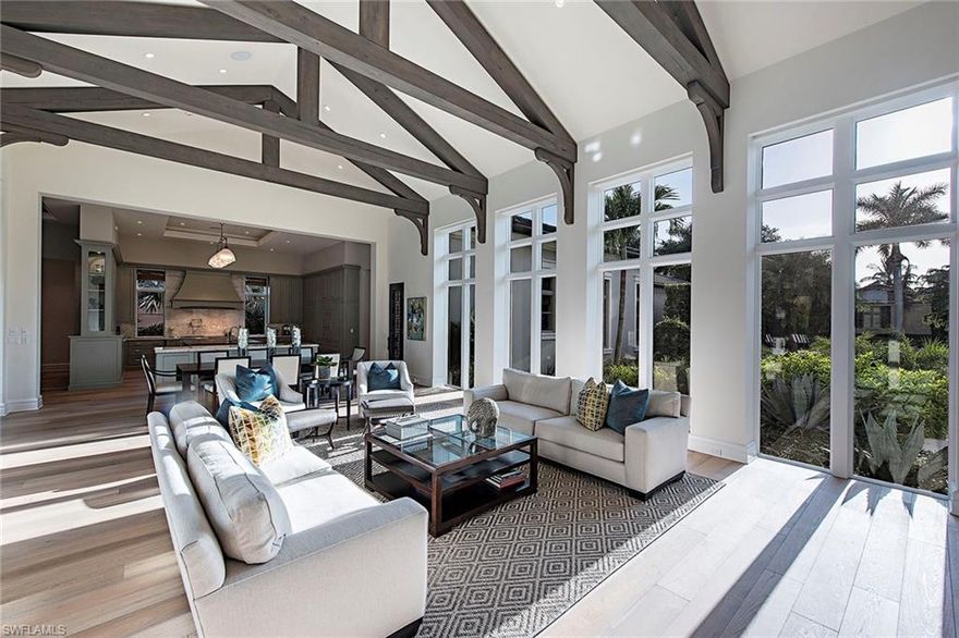 This rarely available nearly new custom-built home has a clean-lined open floor plan featuring a spacious great room with large floor-to-ceiling doors and windows on both sides of the room and cathedral ceiling with exposed wood beams. The moment you enter the front door of this four-bedroom, four-and-a-half-bath home built by BCB Homes in 2013, the custom details are evident including soaring ceilings, wide plank white oak wood floors throughout the home, Andersen impact-rated windows and doors and custom moldings. The top-of-the-line kitchen with double island, two dishwashers, custom cabinetry, hidden pantry and Wolf and Sub-Zero appliances leaves nothing to be desired. The spacious covered outdoor living space with vaulted ceiling is perfect for entertaining and is complete with retractable screens, two-sided linear gas fireplace, full outdoor kitchen with Evo grill and incredible pool and spa including an integrated 40-foot lap lane and separate reflecting pool with eight spillover bowls. Additional features include a temperature controlled wine room, private library with built-in workspace and a climate controlled three-car attached garage with epoxy floor.