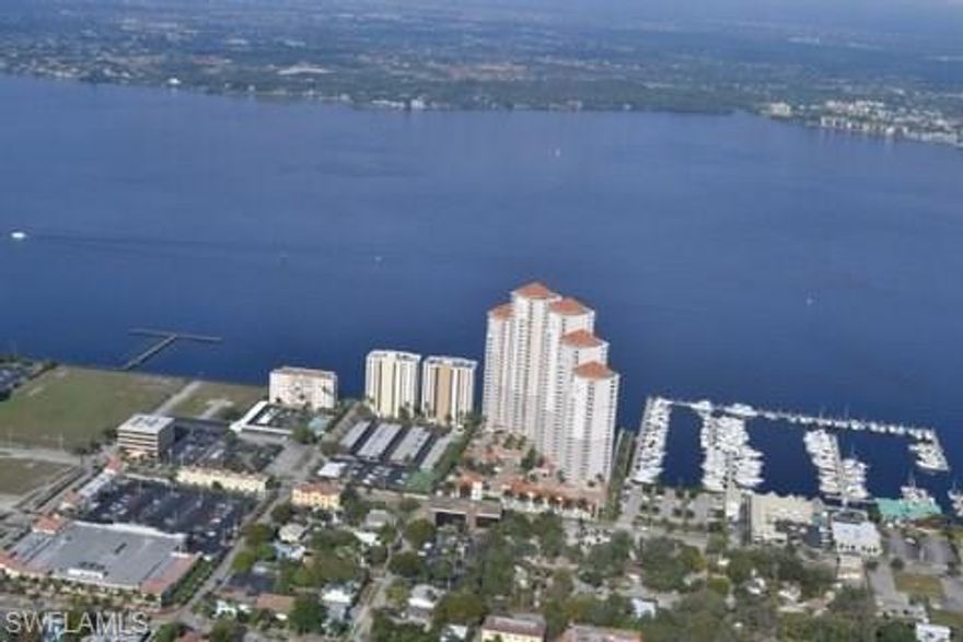 SELLER FINANCING AVAILABLE...LOWEST PRICE at High Point Place!  You will love the urban lifestyle from the best location in the River District.  Riverfront 8th floor residence offering two spacious bedrooms PLUS DEN, two full baths and best of all...two balconies !  Enter your home from a secured elevator directly to your private elevator lobby...through double doors with immediate breathtaking views of the Caloosahatchee River, Legacy Harbour Marina and beyond.  Neutral colors throughout and ready for your decorator touches.  Enjoy all the conveniences of living downtown in the premiere luxury highrise.  24/7 Security, State of the Art Amenities include heated pool, Jacuzzi, his/her saunas, cabanas, BBQ grills, fitness center, social and gathering rooms, guest suites, and more. Remember the most important thing when buying real estate...LOCATION, LOCATION, LOCATION !