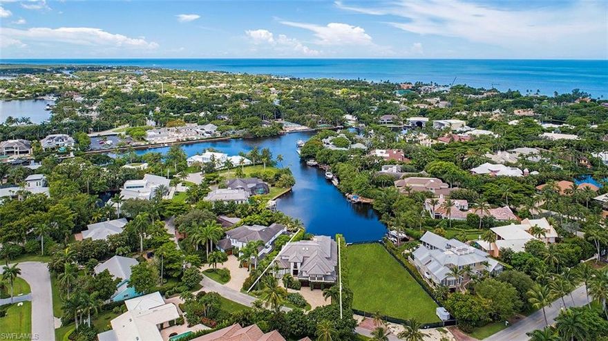 H.16056 - Long SW water views over Jamaica Cove. Pocket sliders open to infinity edge pool & spa offering exquisite views of the peaceful water and colorful skies. Gourmet kitchen w/top line appliances, large granite island, walk-in pantry. Both formal & informal dining, wine room, screened lanai w/built-in grill & pool bath. Roomy, light and bright with lofty planked ceilings. Shows like a model. Refined finishes & sophisticated coastal décor, clean West Indies influenced architecture. Two first floor guest suites, one is used as den now. Elevator leads to glamorous master overlooking the water, with his and her separate en-suite baths & 2 large walk-in closets! Plus 2 more guest suites, a study & exercise room! Direct Gulf access from your dock via Gordon Pass or to the backwaters for a day of fishing in the 10,000 Islands. Just a couple blocks to the sugar sand beaches for a glorious sunset or a plethora of excellent restaurants and shops on Third Street South. Solidly built, concrete block construction in 2010 features impact doors and windows plus a three-car garage. Truly the perfect Naples home in an ideal waterfront location!