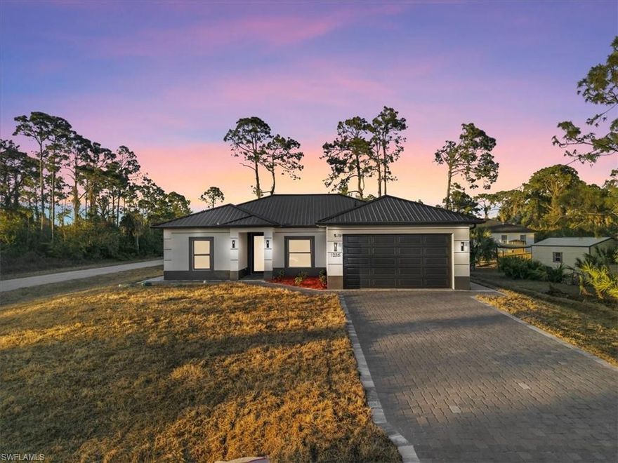 METAL ROOF offering long-lasting durability and protection. Situated on a desirable corner lot, this New Construction,  3-bedroom PLUS DEN home provides flexible space that can be used as an additional room. Features a wider paved driveway and finished walkway that wraps around the house. Enjoy a split-screened lanai designed for multi-use, rain gutters all around and a custom kitchen with a vented range hood through the roof. Built with impact-resistant doors and windows and insurance-friendly features. Conveniently located with easy, quick access to Ft. Myers via Highway 82, in a quiet, beautiful neighborhood. Designed with quality craftsmanship, contemporary finishes, and thoughtful attention to detail throughout.