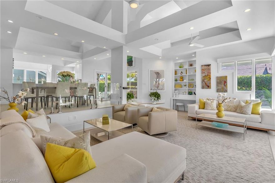 Enchanting Courtyard Entry Villa in Pelican Bay. This pristine, split 2-bedroom, 2-bath corner unit lives like a single-family home, with privacy, plenty of open sky and lush foliage views. A peaceful oasis, just steps from Artis Naples and the dining and shopping options of Waterside Shops. A comprehensive 2023-2024 renovation brings soaring ceilings and walls of glass that flood the home with natural light. The design aesthetic is clean lines and a neutral palette. A perfect backdrop for any décor. The kitchen boasts extensive wood cabinetry, quartz counters, stainless steel appliances and a panelized refrigerator. Thermador induction cooktop and a convection oven make precision cooking easy and enjoyable. Designed for modern living, this home has abundant closet and storage space with interior drawers and slide-out shelves to optimize organization. The open floor plan makes entertaining easy. The kitchen connects seamlessly to both indoor and outdoor entertaining areas. Guests can sit at the counter and engage with the host during meal prep. Dining options are inside, outside, or in the screened lanai overlooking the courtyard. The living room features sliders to a rear patio, a custom bookcase and custom TV cabinet that conceals the television. The primary bedroom suite at the rear of the home, provides a tranquil sanctuary for when the guests are gone. Glass doors separate the bedroom from a spa-like bath and dressing area, which includes 15 linear feet of custom closets and a large double vanity. The natural light from the skylight is reflected in the oversized mirror. A separate water closet is equipped with a Toto toilet and washlet. The guest bedroom holds a king bed, opens beautifully to the courtyard and has 13 feet of custom closets. Both bathrooms boast floating vanities, frameless glass showers, designer tile and Signature Hardware brushed steel faucets and accessories. A cleverly designed office nook conceals a stackable LG washer and dryer and closet. The seamless connection between interior and exterior spaces really enhances the home’s entertaining capabilities. The private pool courtyard provides ample space for sunbathing and gathering, in complete privacy, thanks to a five-foot white brick wall and mature foliage. The final project (May 1 -June 1) will expand the patio seating area, reconfigure the steps and install new 24x24 outdoor porcelain tile and epoxy garage flooring. After that, there is nothing left to do. Pelican Bay is resort-style living with unmatched amenities along the amazing Naples coastline. Residents enjoy tram service to three miles of private beach, chair and umbrella service, two beachfront restaurants, state-of-the-art fitness, wellness, tennis, pickleball, scenic walking and biking paths and more. Bridgeway Villas is a unique community in Pelican Bay, reminiscent of summers on Cape Cod. Need more Room? ASK US ABOUT AN OPTION TO ADD A LOFT!