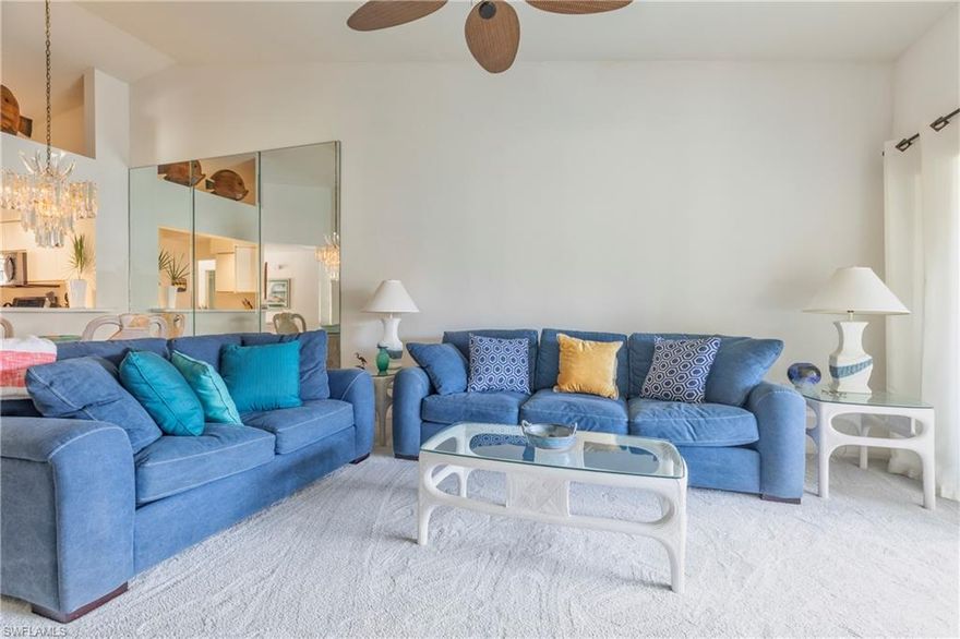 New to the market Sawgrass Point at Pelican Landing.  Light, bright, 2nd floor end-unit has been updated and features 3BR/2 Baths, vaulted ceilings, and tropical furnishings.  This well-maintained condo has been kept meticulously clean and can be your vacation home or used as an investment property. All the roofs in Sawgrass Point have recently been replaced.  The nearby pool and spa is a lushly landscaped oasis within the community. The resort-style amenities of Pelican Landing include tennis, pickleball, fitness center, kayaking, and a complimentary boat shuttle to the private beach which includes umbrellas, chaises and a large indoor facility.