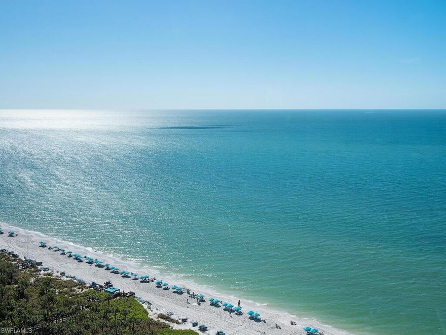 C4571- Super-Rare high floor Beachfront Remington Tower SW corner “01” JEWEL, offering a superlative 5-Star location, tucked smack-dab between The Naples Beachfront Ritz Carlton, The Bay Colony Beach Club, and The Bay Colony Tennis Club. The moment you step from your private elevator directly into this JEWEL, this Gem’s welcoming tone-on-tone creamy interior quietly allows the commanding, mesmerizing, unobstructed, panoramic, tranquil, turquoise Gulf views to take center stage. Dig your toes into Naples’ sugar white sandy beach, just steps away from your included private precious Poolside Cabana. Enjoy daily sunrise or sunset beach strolls, lunch, dinner, or a cocktail at The Club, a challenging tennis match, or a blissful dip in the Gulf or resort style pool, all at your fingertips.  Be further pampered by the lengthy menu of exceptional included Bay Colony and Pelican Bay membership privileges, coupled along with Bay Colony’s World Class Concierge services.