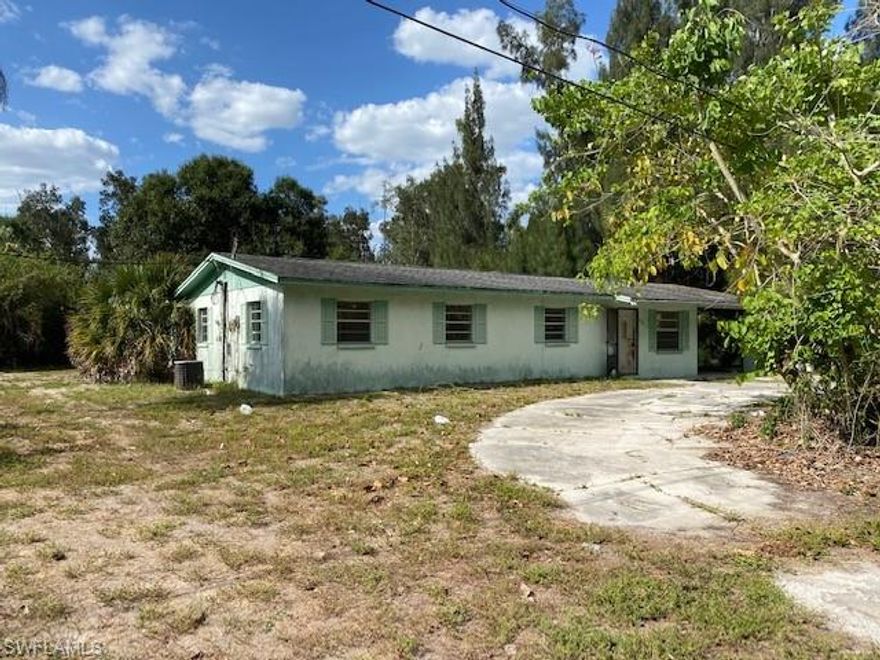 Check out this listing! 3 bed  | 2 bath  | 2088 sq. ft.  - Priced at $239,900 
ATTENTION INVESTORS & CASH BUYERS! A 2088 SF home sits on almost a half acre land, minutes a way from Coconut point area. The house sits on a private un paved road and  in need for a complete remodeling job and can be turned into a dream house in paradise. Enjoy privacy and no restrictions in a central area literally around the corner from high end communities, amenities & minutes from major shopping malls, famous restaurants, universities and surrounded by beautiful houses and communities. The property is zoned AG-2 (  You can park your boat, RV, business vehicles, etc..). This neighborhood is amazing to move in to now and even more amazing as a future smart investment. (LOCATION!!!)
