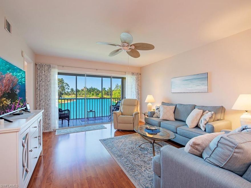 Wow!  What a View!!! WATER, Water Everywhere! Breathtaking and Tranquil Lakefront Views from this impeccably Clean + Turnkey Furnished 2/2, 2nd Floor Condo - with Southern Exposure-overlooking the Giant Lake + Golf Course + Boasting "All of the Bells + Whistles" + More! WOW!!!  Be impressed with this Coastal Bright White Eat in Kitchen with brand new Quartz Counters, New Bosch Dishwasher (2026), newer appliances, under counter lighting + a Breakfast bar, too! There's a combination Living and Dining Room that is big enough to entertain your friends and Family!  There's a Great Sized Master Suite with a Frosted Glass Shower, Tasteful Guest Bedroom offering twin beds, There's a Laundry room with extra storage, and The Bright + Airy Lanai offers electric Storm shutters, too!  Don't miss the laminate Wood and Tiled flooring throughout, newer A/C 2023, Newer Hot Water Heater, 2024, comfort height toilets, All Tastefully decorated with High End Furnishings, Hunter Fans, New Paint, New Box Springs + Mattresses, No POPCORN Ceilings, + a Carport, too!  If you have a Buyer who's looking for an Affordable Bundled Golf and Tennis Community...All conveniently located, including a newly renovated Clubhouse, Restaurant, Pools, Tennis, Pickleball, Bocce, new 4500 sq ft gym, and low HOA Fees + Activities Galore, Show them this Condo...It will not disappoint!!!  Wow!